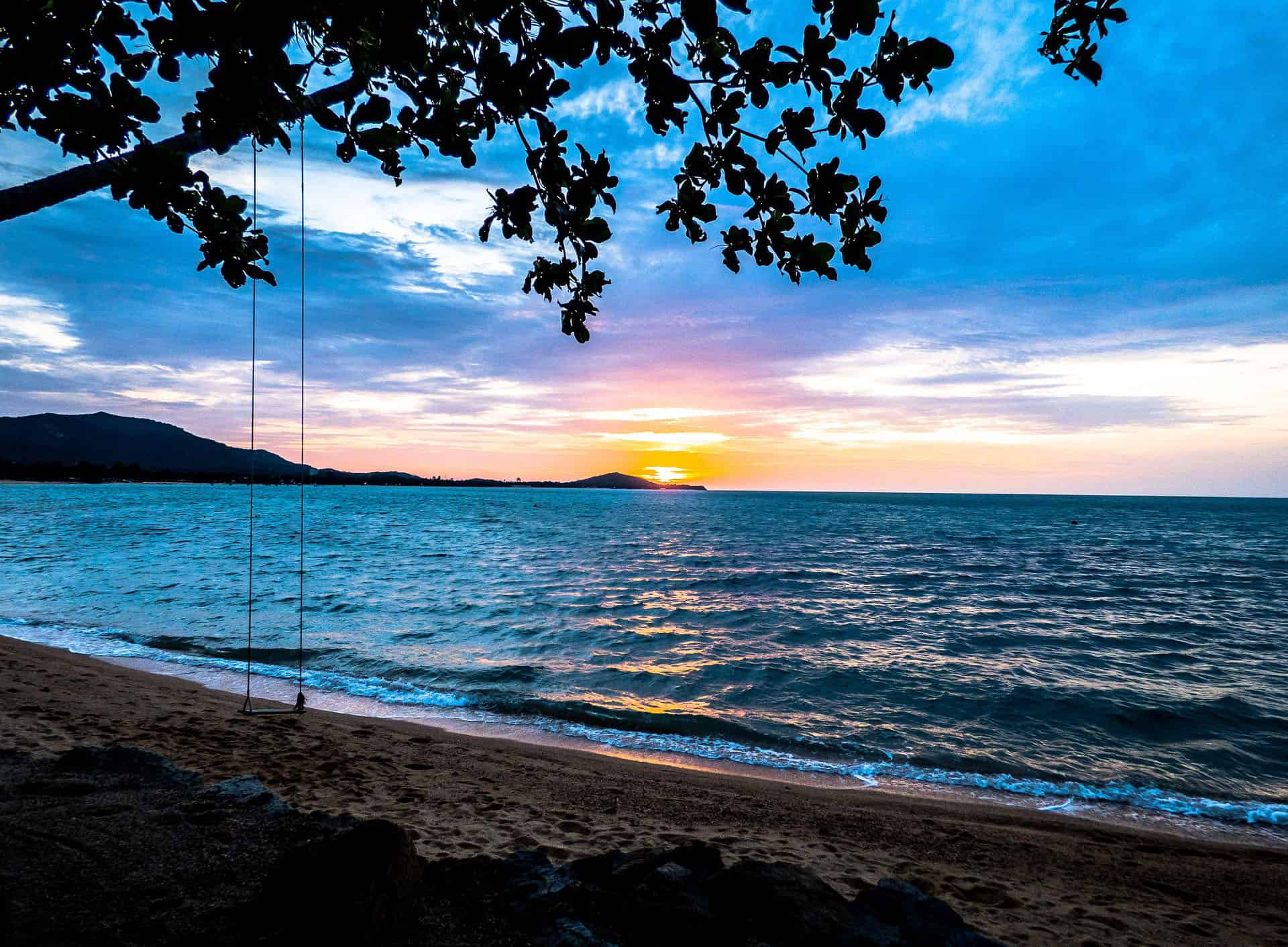 best beaches in thailand swing at sunset